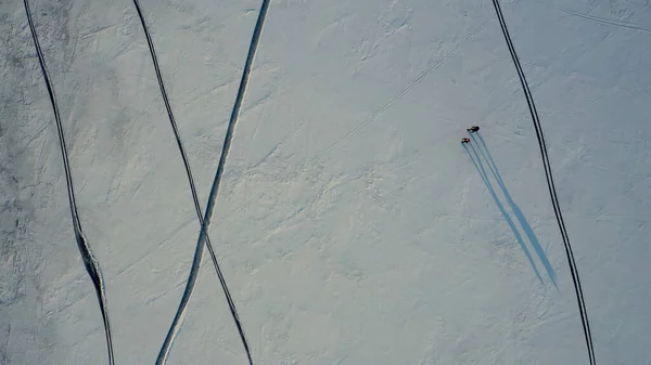 Upper View Two Tourists Walking Snow Field — 스톡 사진