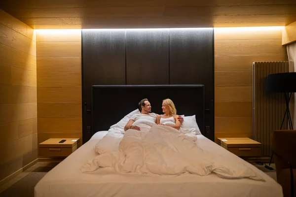 Romantic Couple Lying Bed Hotel Room — Stock Fotó