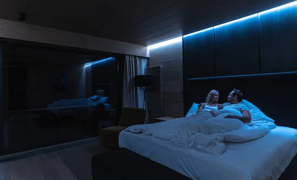 Romantic Couple Lying Bed Hotel Room – stockfoto
