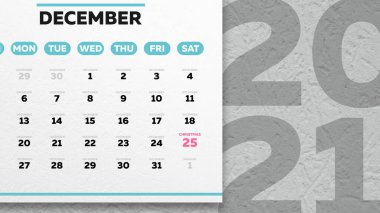 Takvimin güzel bir Aralık sayfasındaki yakın plan. Üzerinde Noel tarihi ve duvarında 2021 yazılıydı.