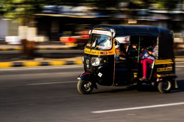 yellow and black auto in motion