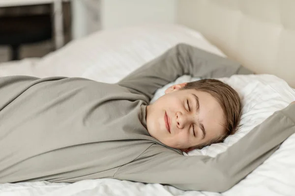Teenage Boy European Appearance Lying Bed His Eyes Closed — Stockfoto