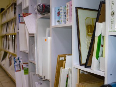 Canvases Arranged by Size in Cells on the Shelf of the Stationery Store. Variety Professional Blanks, Albums for Artists and Designers. Creative Education Concept.