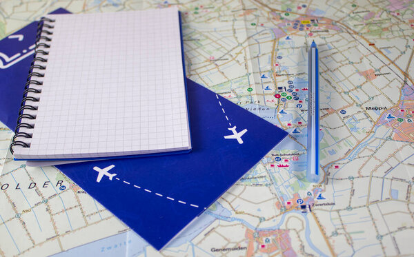 Air tickets, Notepad and Pen on the Map. Business Travel Traveling on the Map. Tourism concept.