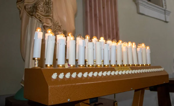Candles on the background of the church. Prayer candles. The concept of faith.