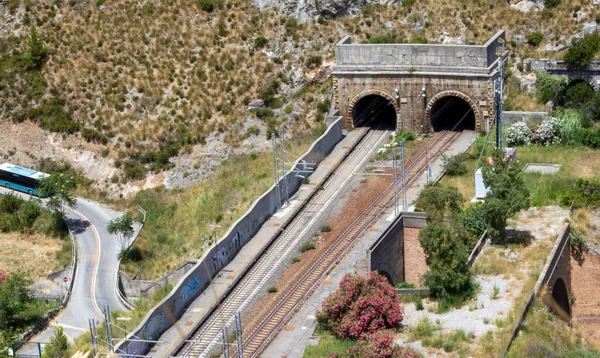 Tunnel in the mountains in Italy. Entrance to the railway tunnel. View from above.