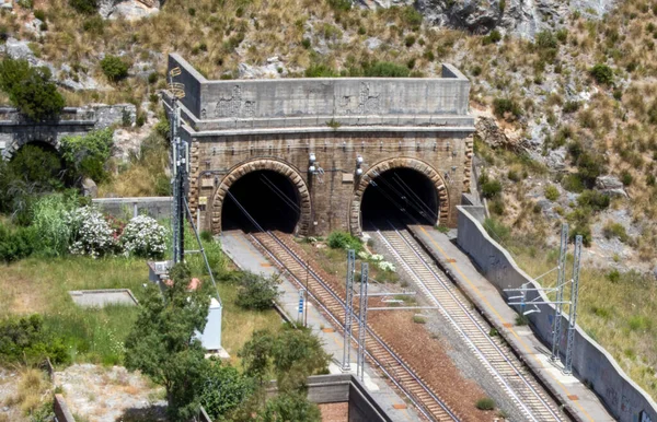 Tunnel in the mountains in Italy. Entrance to the railway tunnel. View from above.