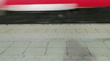 Bullet train Passing at High Speed at the Station. An Express Train Passes Through the Station at High Speed. located at a Station in Calabria, Italy.