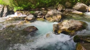 Motion of waves on dark water surface with play of flecks of bright light close up. Amazing dramatic natural background.  Epic mystical and magic night view. Crystal clear.