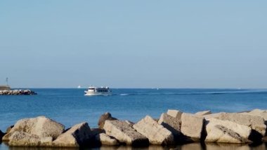 Front view of a White Pleasure Boat on a Summer Day. A Motorboat Flies Through the Waves Wirom at Dawn, Creating a Concept for the Future of the Metaverse of Infinity. Motorboat, the Best Italian Yacht.