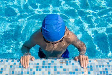 Boy in the Pool. Sports Swimmer Getting Ready for Action in the Pool. Diving, Water Sports.