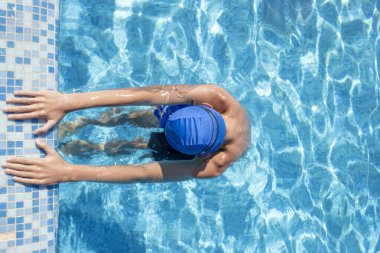 Boy in the Pool. Sports Swimmer Getting Ready for Action in the Pool. Diving, Water Sports.