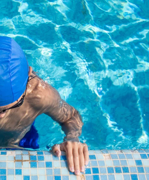 Boy in the Pool. Sports Swimmer Getting Ready for Action in the Pool. Diving, Water Sports.