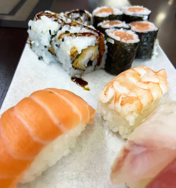 Japanese Food, Sushi and Sashimi. Rainbow Sushi Roll with Salmon, Eel, Tuna, avocado, Royal Prawn, Cream Cheese Philadelphia, Caviar Tobica, Chuka. Sushi Menu. Japanese Food.