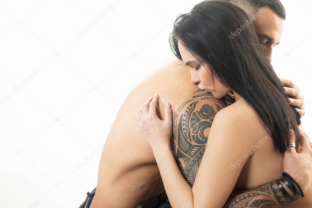 Sensual passionate couple gently kissing, enjoying tenderness and intimacy. Young sexy affectionate coupl. Romantic lovers face each other.