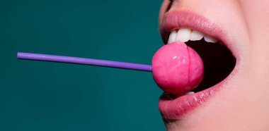 Close up lips with lollipop isolated, sexy blowjob, sensual mouth with lipstick eats sweets. Sexy design banner for women and girls. Beautiful lips.
