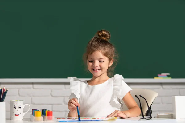 Child girl at school draws with paints. Kids artist creativity. Kids art, creativity children. — Stock Photo, Image