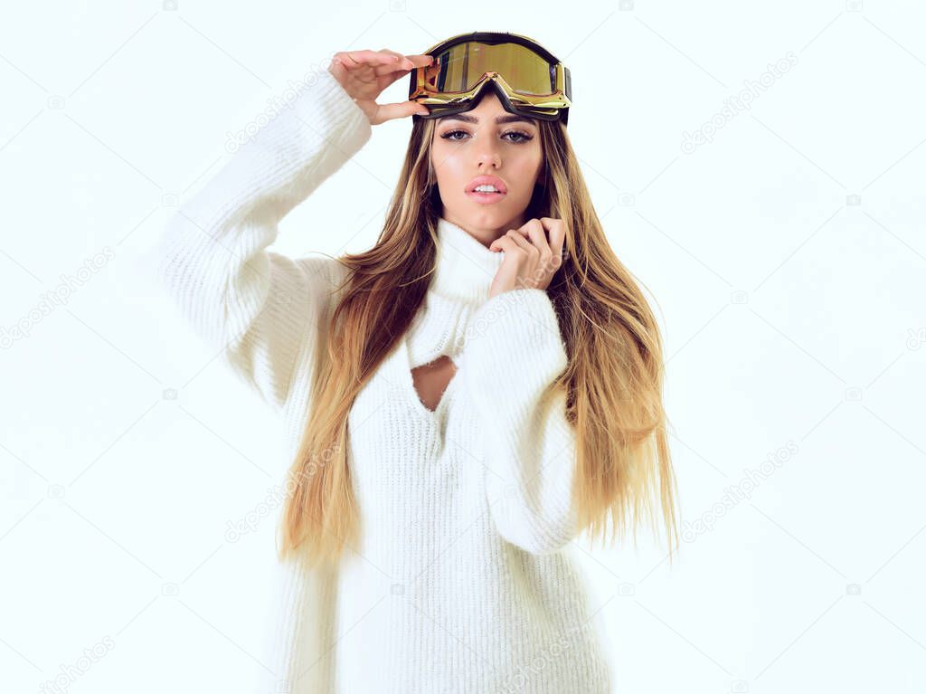 Young girl in winter wear. Ski glasses. Sexy woman in winter clothes.