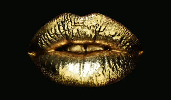 Gold lips. Gold paint from the mouth. Golden lips on woman mouth with make-up. Sensual and creative design for golden metallic. Golden make up. Isolated on black. — Stock Photo, Image