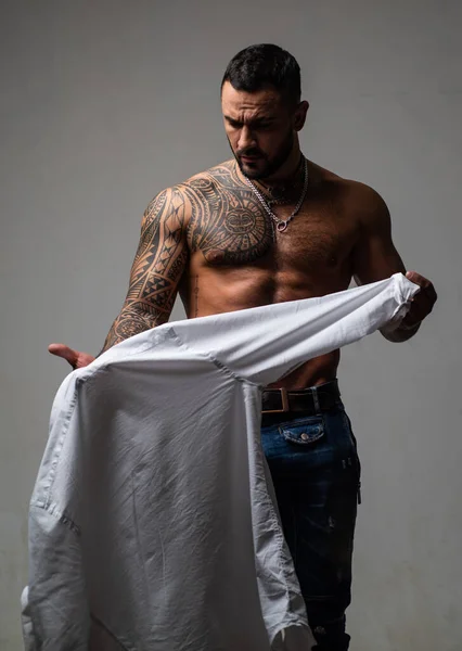 Sexy man undressing shirt. Sexual desire. Sensual guy. — Stock Photo, Image