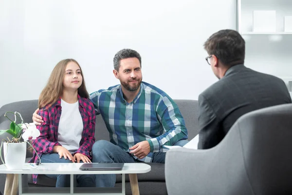 Father and child daughter with girl discussing problems in family with family psychologist. Discussion of family problems with psychologist. Parents telling the psychologist about child problems.