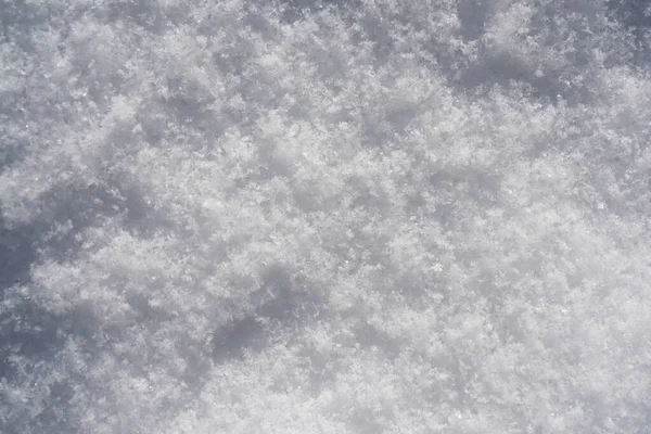 雪の背景、雪のテクスチャ。抽象的な背景としての白い雪. — ストック写真