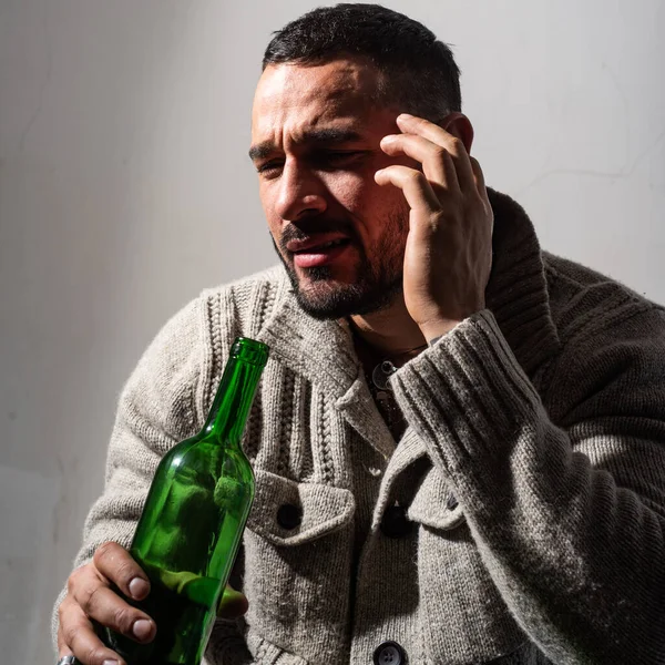 Alcoholic man with bottles wine cry. Depressed crying man. Drunk men drinking alcohol feeling lonely and desperate in emotional stress. — Foto Stock