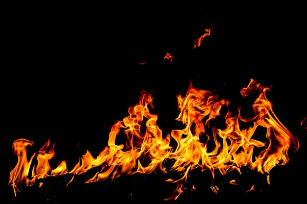 Llamarada llama de fuego ardiente sobre fondo de textura de arte. — Foto de Stock