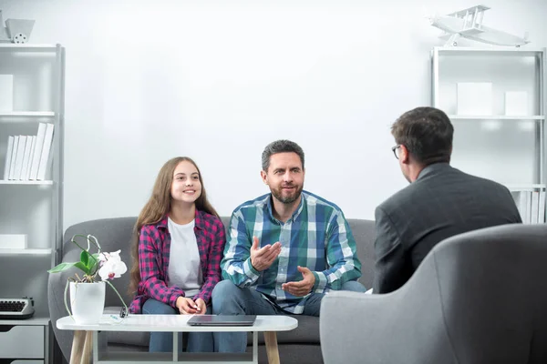 Parenting conflicts, kids crisis. Psychology, mental family therapy, psychologist with father and daughter at psychotherapy session on psychological consultation.