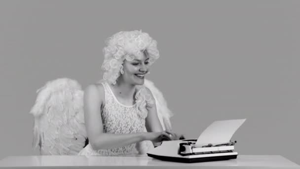 Beautiful young sexy woman typing letter. Love and valentines day. Symbol of love. Christmas and Valentines Day. Black and white. — Video Stock