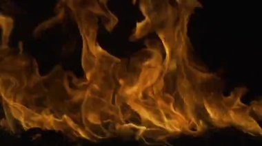 Yanan konsept. Ateş alevi dokusu. Alevler arka planı kaplıyor. Şeytan ateşi, cehennem kavramı..