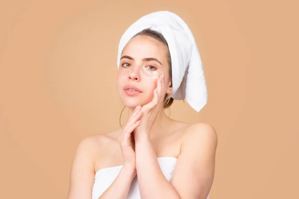 Facial treatment. Cosmetology beauty and spa. Girl apply skincare cream on face, woman wrap towel on head put facial creme on doing morning healthy skin. — Stock Photo, Image