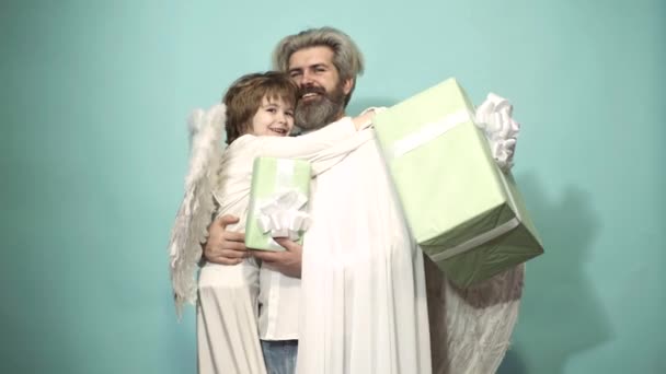 Valentine day with father and son with valentine gift. Love family concept. Valentin man with angel wings. Valentines Day. Parenting, parent with child boy, childhood. — ストック動画