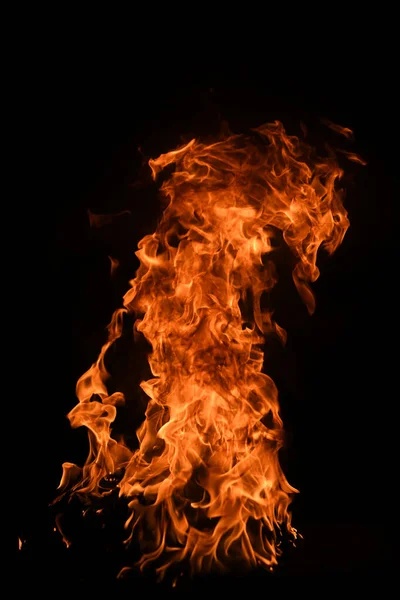 Texture of fire on a black background. Abstract fire flame background, large burning fire. — Stock Photo, Image