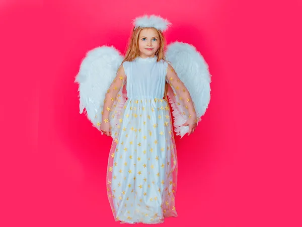 Beautiful little angel girl. Portrait of innocent girl angel with angelic wings. Child with angelic character. Toddler girl wearing angel costume white dress and feather wings. Valentine card. — Stockfoto
