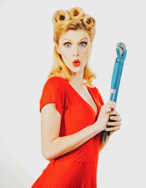Retro woman with repair instruments. Building and construction. Repairment tools.