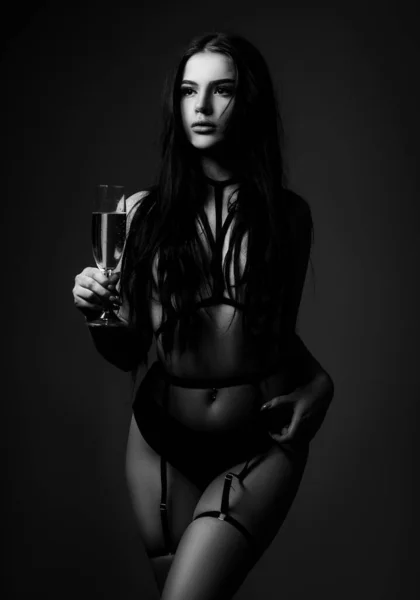 Sexy lingerie. Bondage and bdsm concept. Confident lover. Seductive temptress. Slim woman dressed in black lingerie and tied with ropes. Lingerie sexy girl model in darkness. Female in sexy bikini — Foto Stock