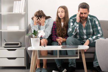 Trouble couple with unhappy child teenager discussing problems in worry family. Conflicts marital couple with kids crisis. Sad father and mother with sad daughter teenager.