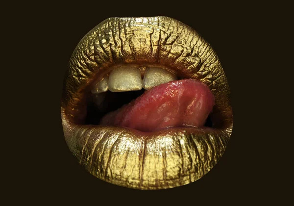 Gold lips, golden gloss lipstick. Cosmetics and make-up. Gold lips lipstick and gloss. Sexy and sensual lips. Golden lips closeup.