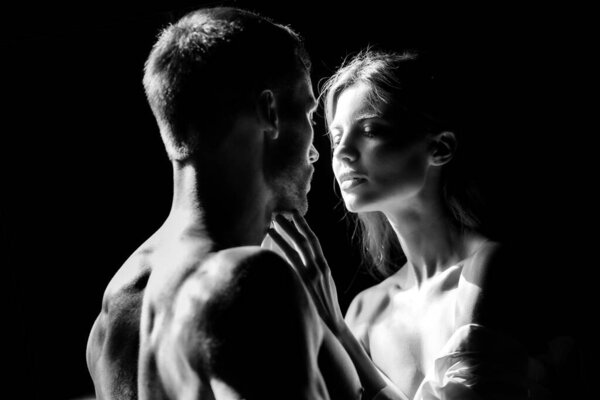 Couple in love face to face, tender hugging and kissing. Beautiful woman and handsome man boyfriend.