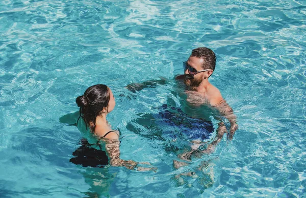 Couple in pool. Summer pool resort. Life winner. Butt in bikini. Pool party. — Foto de Stock