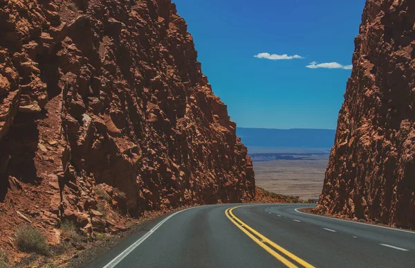 American road trip. Rural asphalt road among the rock mountain road. — Stock Photo, Image