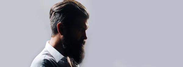 Closeup profile silhouette of bearded man with classic black long beard, bearded gay. Barber barbershop. Mustache men, serious face close up. Templates web banner design. Banner for website. — Stock Photo, Image