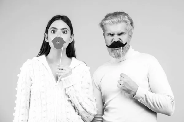 Photo booth concept. Couple having fun with with fake mustache and lips. — Stock Photo, Image