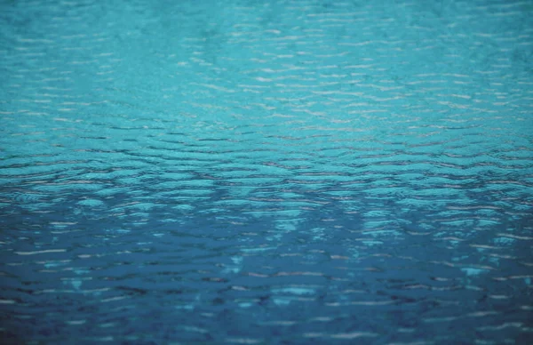 Water in swimming pool, background with high resolution. Wave abstract or rippled water texture. — Stock Photo, Image