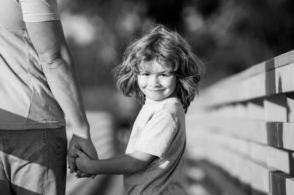 Father and son holding hand in hand. Weekend activity happy family lifestyle concept. — Stock Photo, Image