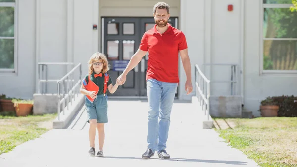 Outdoor school. School boy going to school with father. Parent with child in front of School gates. — Stock Photo, Image