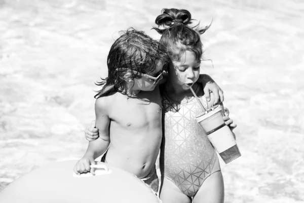 Kids summer weekend holidays. Summertime vacation. Couple of children in swimming pool. — Stock Photo, Image