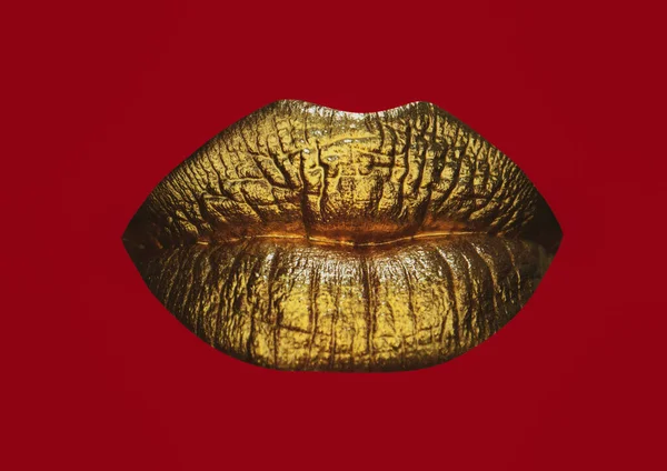 Luxury gold lips make-up. Golden lips with golden lipstick. Gold paint on lips of sexy girl. Sensual woman mouth, isolated background. Female gold glitter lipstick. Isolated on red.