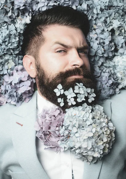 Flower bow-tie. Elegant business man with classical costume. Man in blue suit. Bearded man and flower beard. Spring necktie. Elegant business man with classical costume. — Stock Photo, Image